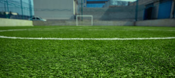 The empty football field and green grass