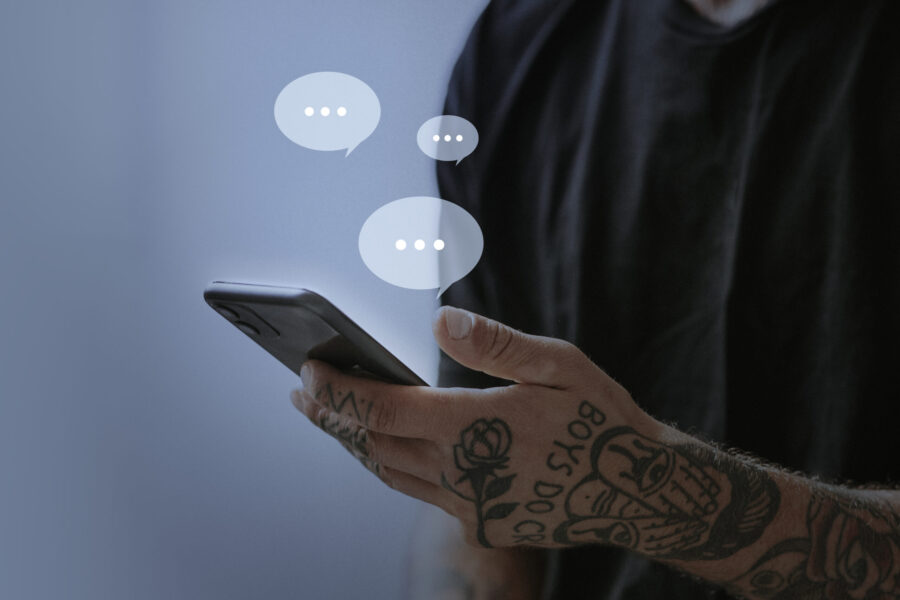 Tattooed man texting for social media remix