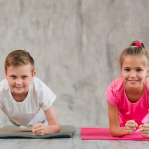 portrait-smiling-boy-girl-doing-fitness-exercise-front-concrete-wall_23-2148186476-1-1024x683